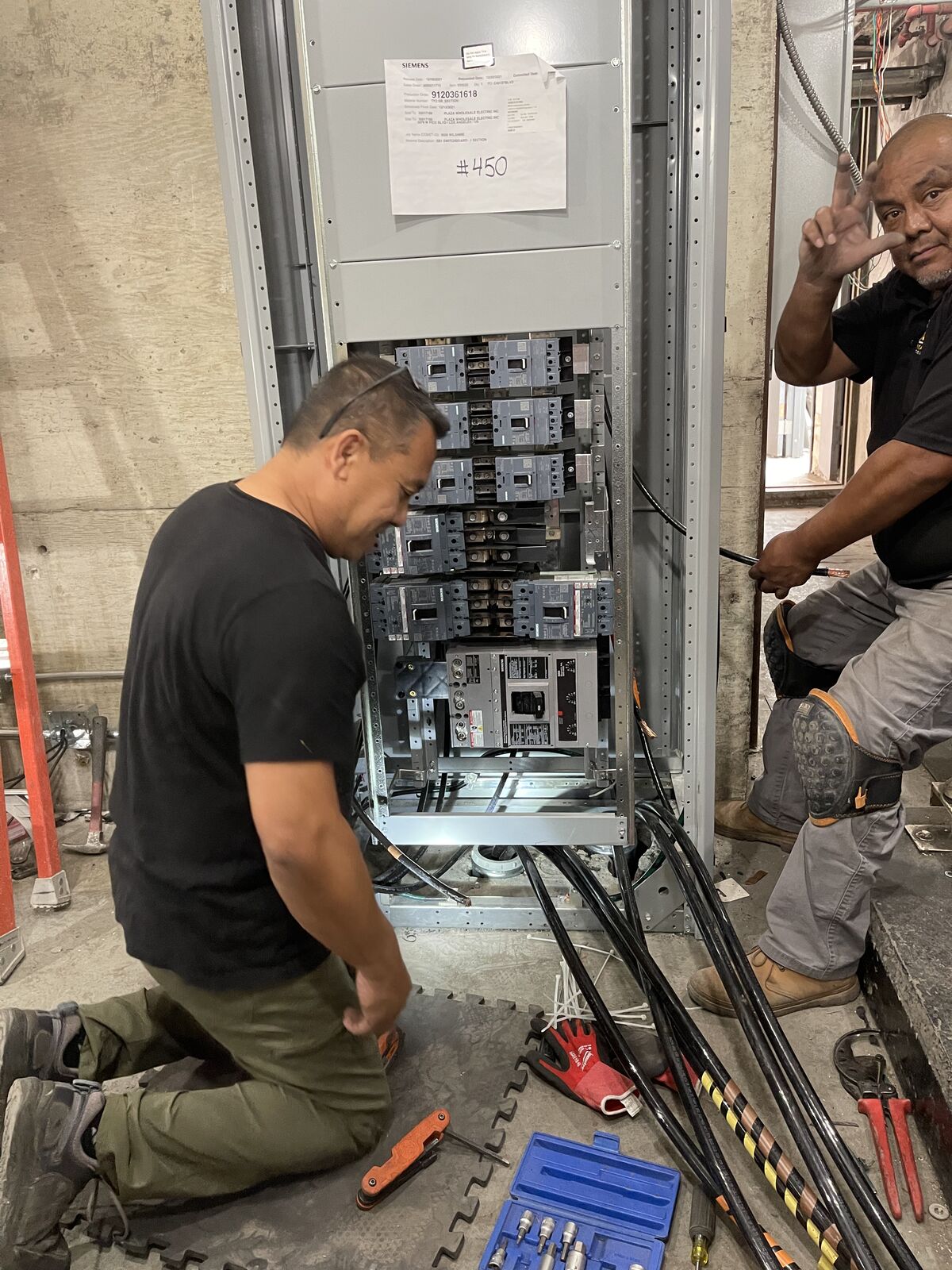 RJ Electrical crew at work inside commercial switchgear